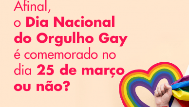 imagem miniatura, na cor rosa e texto "Afinal, o Dia Nacional do Orgulho Gay é comemorado no dia 25 de março ou não?" figura de um coração nas cores da bandeira LGBTQIA com uma mão segurando a bandeira. Fim da descrição.